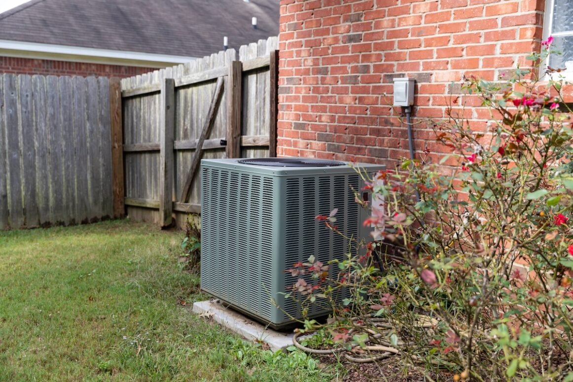 Air Conditioner system next to a home Air Conditioner system next to a home