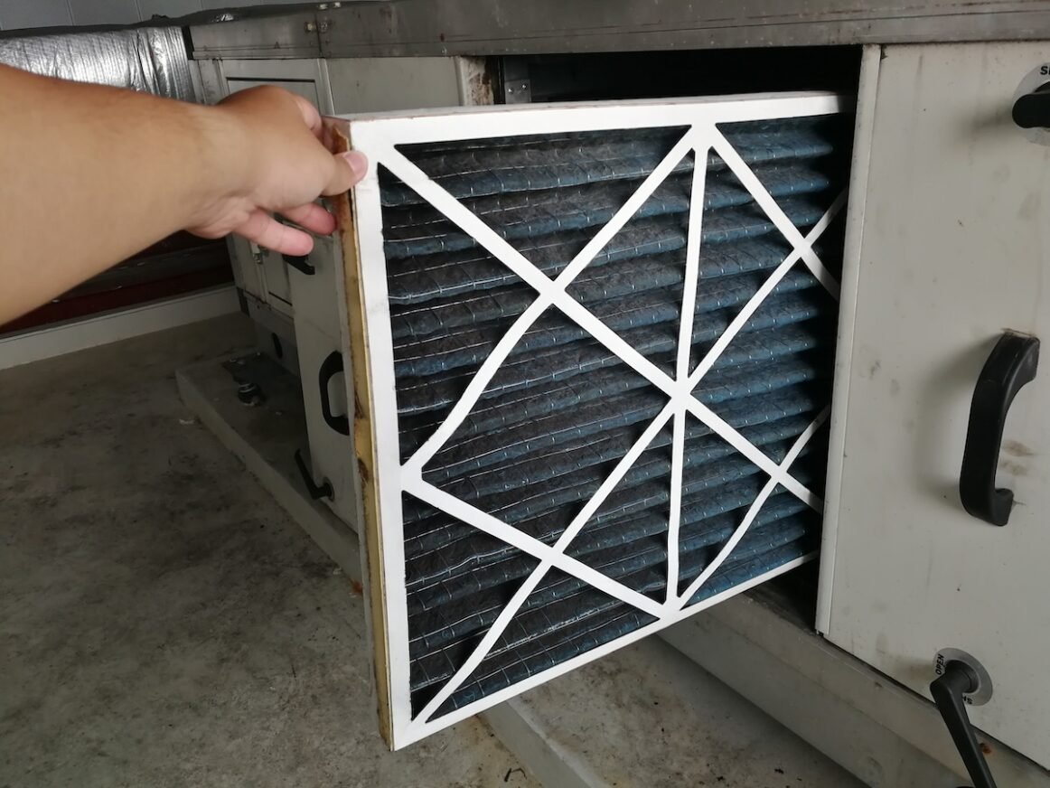best furnace filters Soft Focus to Filter of Air handing Unit, Technician checking a Pre-filter of air handling unit for replacement a new filter - HVAC maintenance