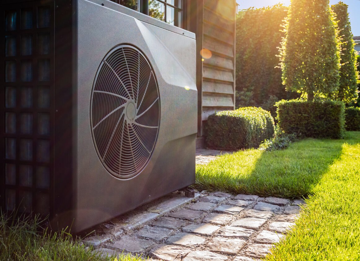 Air heat pump near pool house outdoors. Air heat pump near pool house outdoors.