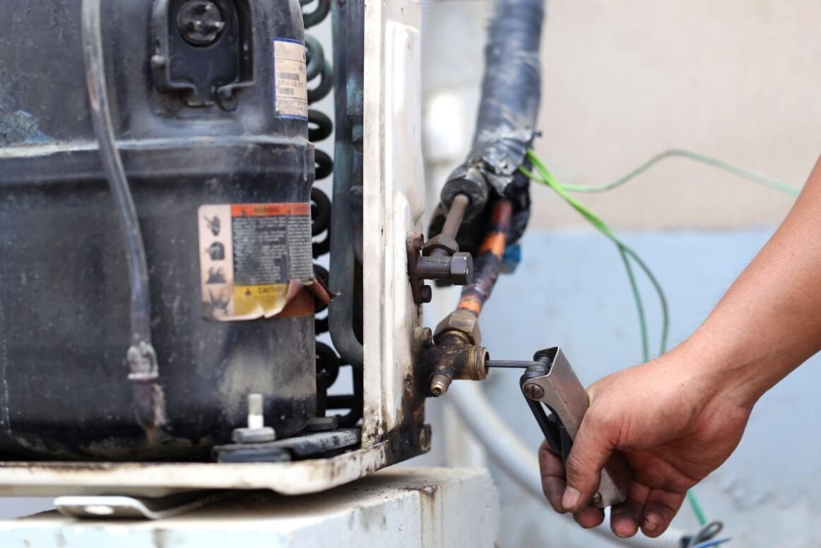 furnace smells like burning technician repairing old furnace